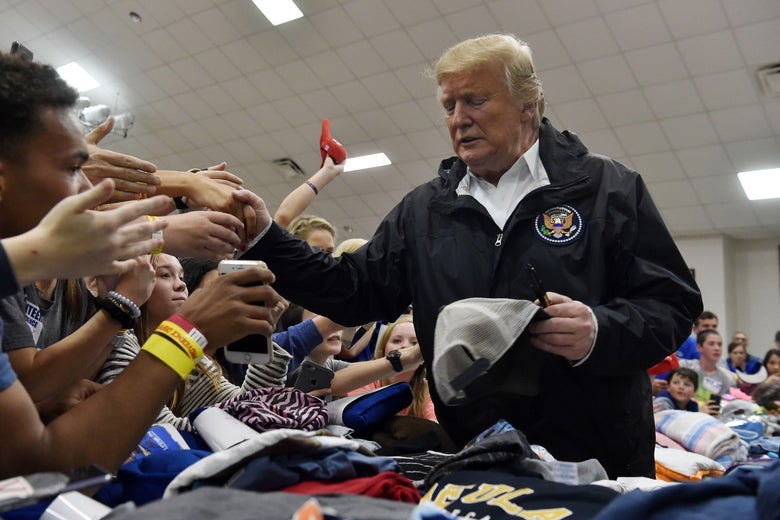 President Donald Trump greets residents.